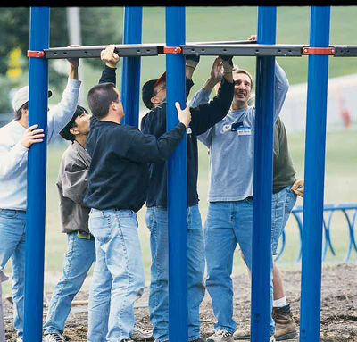 picture of men working on community build playground